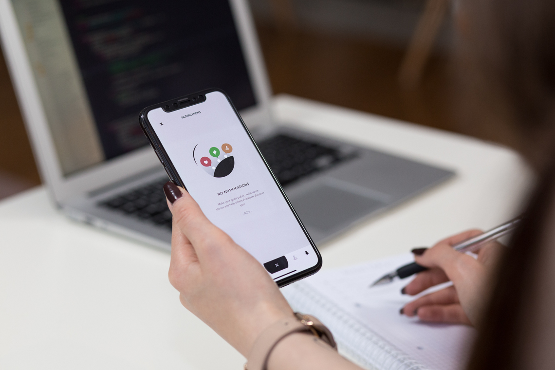 Woman's hand holding a smartphone