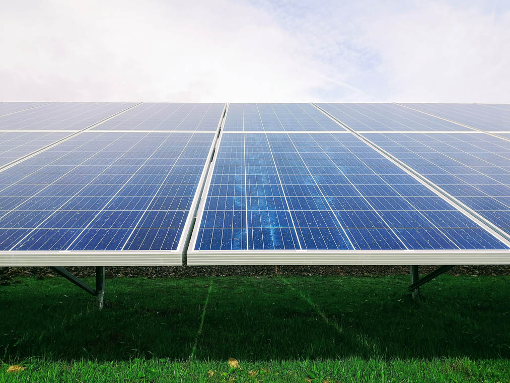 Solar panels in a green field