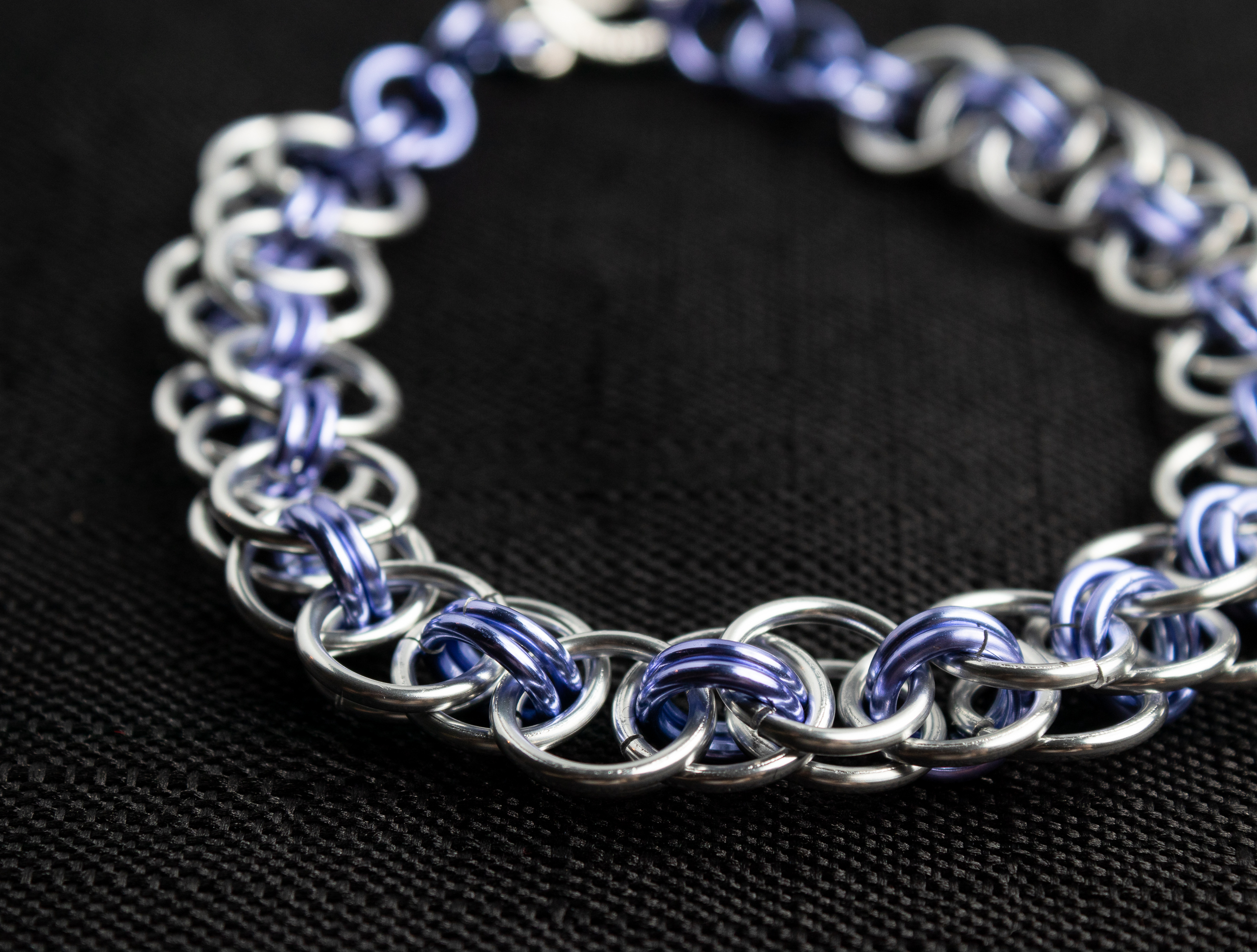 Close-up of a purple and silver chain bracelet